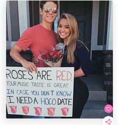 a man and woman holding a sign that says roses are red, your music taste is great in case you don't know i need a hoo date