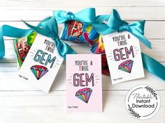 three cards with the words you're a true gems on them are tied to a blue ribbon