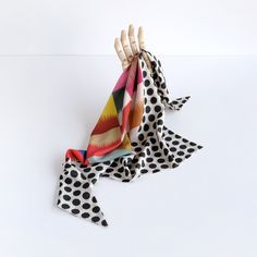 "A newly designed triangle shape scarf is composed by Cinne in two of her original prints. Throw it on for an instant chic statement, giving any look a stylish twist. Style it around your neck or waist or in your hair. This soft triangle scarf is large enough to cover your head and looks fabulous under a hat. It's constructed entirely by hand with love and attention to every detail. Ready to ship, ready to gift. color Black and white scallop dots surround a center circle containing a bold, delig Chic Multicolor Shawl Scarves, Chic Multicolor Shawl Scarf, Chic Multicolor Scarves For Summer, Chic Multicolor Summer Scarves, Chic Multicolor Silk Scarf For Parties, Trendy Multicolor One-size Silk Scarf, Chic Hair, Twist Style, Triangle Scarf