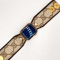 The "Willow" is a beauty and is a hand-crafted designer watchband made with olive green suede leather and topped with the classic brown GG monogram material from a real bag. The band is secured with gold fitting connectors that will slide into your apple watch securely. There are two gold high-quality snaps have been added to allow for adjustability and comfort fit. Each band is approximately 3.5 inches with snaps at .5 and 1.25. The secure clear crystal adds a nice little bling to the band! Fit Designer Gold Watches With Leather Strap, Designer Gold Leather Watch Accessories, Luxury Gold Watch Accessories With Leather Strap, Luxury Gold Watch With Leather Strap, Luxury Gold Leather Strap Watch Bands, Luxury Gold Watch Bands With Leather Strap, Adjustable Timeless Bracelet Strap Watch Band, Luxury Adjustable Apple Watch Band For Gift, Designer Brown Adjustable Bracelet