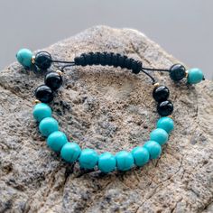 Natural blue turquoise and black onyx shambala bracelet. Gift for her. black nylon rope, gold spacers, everyday bracelet. balance Bohemian Black Braided Bracelet With 8mm Beads, Black Bohemian Braided Bracelet With 8mm Beads, Black Spiritual Friendship Bracelets With Sliding Knot, Mens Onyx Bracelet, Black Beads Bracelet, Shambala Bracelet, Mens Bracelet Fashion, Beading Bracelets, Turquoise And Black