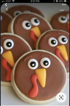 cookies decorated to look like turkeys with googly eyes