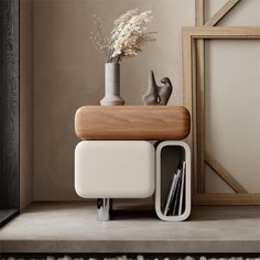 a vase with flowers in it sitting on a shelf next to a book case and other items