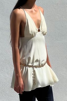 Show stopping, delicate and dainty, our Mini String Dress is inspired by one’s pre-teens, reimagined and crafted with pure luxurious silk combo, chiffon and crepe de chine. Elegant Backless Chiffon Mini Dress, Elegant Flowy Mini Dress, Chic Silk Chiffon Dress For Summer, Chic Summer Silk Chiffon Dress, Elegant Beige Chiffon Mini Dress, Chic Summer Wedding Silk Dress, Chic White Silk Wedding Dress, Elegant Backless Silk Dress For Spring, Ethereal Silk Party Dresses