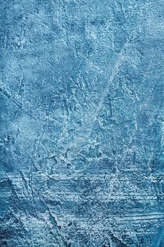 an abstract blue background with scratches in the middle