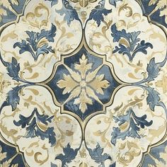 an ornate blue and white tile with gold accents