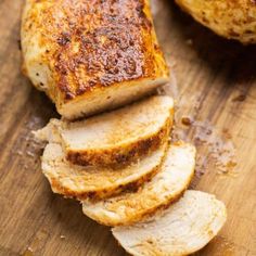 slices of chicken on a cutting board with seasoning