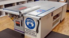 a table saw sits on top of a workbench