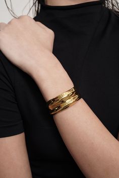 The Allure Cuff is a standout bracelet guaranteed to make a statement. Plated in 18k Gold with a special e-coating for scratch resistance, the Allure Cuff is guaranteed to be a staple in your closet.