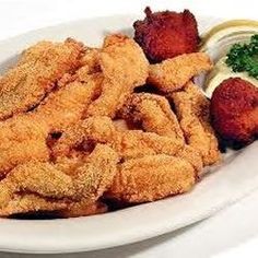 fried food is served on a white plate