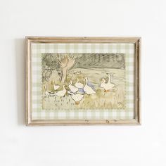 a painting hanging on the wall with ducks in it