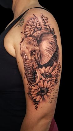 an elephant and sunflowers tattoo on the arm