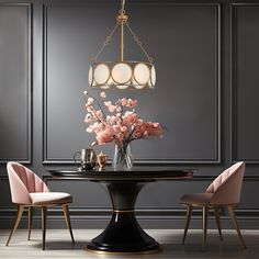 a dining room table with pink chairs and a chandelier