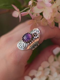 This magical shield ring was designed to protect you from evil and make you feel confident and happy in your skin. Entirely handcrafted in sterling silver, this ring features a lovely faceted amethyst gemstone and handmade embellishments. Size 6.5, but due to its wide band, the ring will comfortably fit size 6. You can see how this ring was made in this video: ➥ All Stardust Mine products are made by hand of a real person and not machine, using precious and semi-precious metals and natural stone Spiritual Amethyst Ring With Accent Stones, Spiritual Silver Amethyst Ring In Sterling Silver, Unique Amethyst Rings With Gemstone Accents, Unique Sterling Silver Butterfly Ring, Bohemian Sterling Silver Jewelry With Accent Stones, Bohemian Sterling Silver Crystal Birthstone Ring, Handmade Sterling Silver Butterfly Promise Ring, Mystical Sterling Silver Open Crystal Ring, Handmade Bohemian Sterling Silver Butterfly Ring