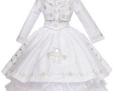 Your  Beautiful girl will love wearing this mariachi charro dress at any formal event.  this dress  embroidery whit silver floral and horseshoe embroidery, long ruffled skirt, and a lace-up back. This dress comes with a matching hat  Colors: White/Silver Material: Organza Cleaning Directions: Spot clean only Please after you place your order we us you girls sizes  shoulder to shoulder  shoulder to the floor Around the chest  Around waist   So we could give you the correct size  We do have size 2-12 Embroidered Fitted Dress For Pageant, Embroidered Fitted Dress For Pageants, Fitted Embroidered Dress For Pageants, Fitted Embroidered Dresses For Pageants, Fitted White Dress For Quinceanera, White Fitted Dress For Quinceanera, Fitted Wedding Dress For Fiesta, Horseshoe Embroidery, Long Ruffled Skirt