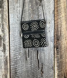 "A beautiful Mudcloth and leather bag, perfect for small items like a passport, a phone, and small wallet. Made with genuine leather and a n authentic Mudcloth textile. Check out www.awanya.com to learn more about Mudcloth and how it's made. Each bag is one is unique and one-of-a-kind.  Design may vary with each piece. 7.5\" tall 6.5\" wide" Handmade Black Wallets For Travel, Pouch With Zipper, Coin Purses, Small Wallet, Mud Cloth, Leather Pouch, Small Items, Louis Vuitton Monogram, Leather Wallet