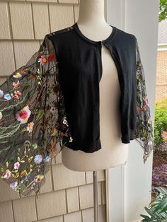 Ooak size medium black embellished cropped cardigan Size 8-10 Full refund if not satisfied Summer Long Sleeve One-size Shrug, Elegant Embroidered Spring Cardigan, Chic Cardigan For Spring Party, Chic Spring Cardigan For Parties, Long Sleeve Summer Shrug For Party, Fitted Bohemian Cardigan With Floral Embroidery, Chic One-size Spring Cardigan, Chic Long Sleeve Cardigan For Festival, Fitted Bohemian Cardigan For Summer