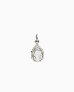 The Dewdrop Stone Pendant boasts a distinctively timeless design, featuring a pear-shaped white topaz stone cradled in sterling silver. Whether worn on its own for understated elegance or paired with a pair of Dewdrop Stone Earrings for a coordinated look, this pendant adds a touch of sophistication to any outfit. Pair with your favorite chain, sold separately. Metal: Sterling silver Stone: White topaz Dimensions: 20mm x 10mm Style #: P195W Silver Teardrop White Topaz Jewelry, Sterling Silver Teardrop Jewelry With Rose Cut Diamonds, Modern Teardrop Rose Cut Diamond Jewelry, Elegant Silver Water Drop Earrings, Classic Sterling Silver Teardrop Pendant, Hook Bracelet, Topaz Stone, Understated Elegance, Stone Pendant