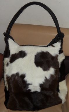 Basic Features of Cowhide Leather Rodeo Bucket Purse & Hand Bag -Dome closure -One inside zipped pocket-Two phone/card pockets-Size: 35(L) x 37(H) x 19(W) cm-Strap length 60cm approx. PLEASE DO NOT HESITATE TO ASK ANY QUESTION RELATED TO OUR PRODUCTS. Black And White Purse, Slouch Bag, Cowhide Purse, Cowhide Handbags, Fur Purse, Bucket Purse, Cowhide Bag, Picture Inspiration, White Purse