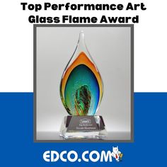 a glass award with the words top performance art glass flame award