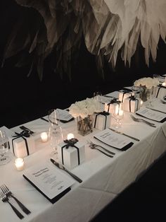 the table is set up with place settings for dinner guests to enjoy their meal together