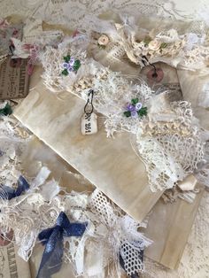 an assortment of laces and ribbons are laid out on top of the doily