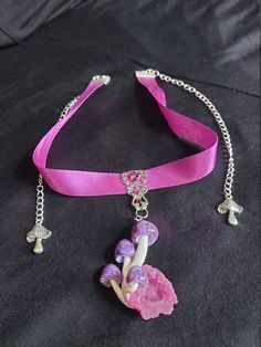 Very pretty little purple swirly mushroom cluster set on a pink quartz geode.  Pendant is set on a filigree piece, adorned with swarovski crystals. Sits on a 13 inch ribbon choker that has extenders on both sides so its able to fit  from 13 to 19 inches, if you need it longer let me know and I can move the clasp. Handmade Whimsical Choker Jewelry, Adjustable Whimsical Jewelry For Party, Adjustable Whimsical Choker, Whimsical Adjustable Choker, Adjustable Pink Jewelry For Festivals, Handmade Pink Choker As A Gift, Handmade Pink Choker As Gift, Pink Adjustable Choker As A Gift, Whimsical Party Choker Jewelry