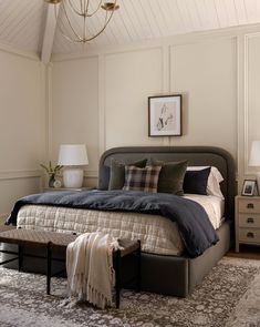 a bedroom with a large bed and two nightstands