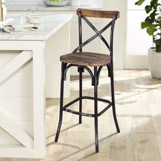 a wooden and metal bar stool in a kitchen