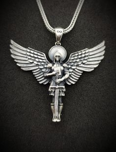 Silver Warrior Angel Handmade Pendant ✦Details * Material: 925 Sterling Silver * Pendant Diameter: Total 1.73 inch, Length 1.44 inch (36mm) / Width 1.77 inch (45mm) * Weight: 14-15 grams * Finish: Oxidized and Polished * Bail With: 0.17 inch, 4.40mm * Chain Thickness : ( 0.05 inches ) 0.14 cm  * Chain Weight : 18 Inches -  (45cm) = 4.48-4.80 Gr 20 Inches -  (50cm) = 5.08-5.25 Gr 22 Inches -  (55cm) = 5.39.5.69 Gr 24 Inches -  (60cm) = 6.20-6.40 Gr 26 Inches -  (65cm) = 6.45-6.85 Gr 28 Inches - Handmade Silver Mythological Necklace, Silver Handmade Mythological Necklace, Warrior Style Engraved Pendant Jewelry, Engraved Warrior Style Pendant Jewelry, Silver Engraved Warrior Necklace, Silver Warrior Style Necklace For Gift, Warrior Style Engraved Sterling Silver Jewelry, Warrior Angel, Angel Warrior