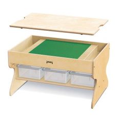 a wooden table with two drawers and a green mat in the bottom drawer for storage