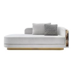 a white couch with two pillows on it