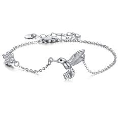 PRICES MAY VARY. 💖Hummingbird Story: Hummingbird symbolizes hundreds different joyful and lucky meanings from original stories varys in different places over the world. A hummingbird shows the lightness of being, and enjoyment of life. Teaches us to heal life with the magic of flowers. This cute hummingbird bracelet is the perfect gift for your beloved, or hummingbird lovers and collectors. 💖 Material: 925 sterling silver Hummingbird jewelry,hypoallergenic, tarnish resistant,nickel-free,lead-f Adjustable Bird Design Jewelry As Gift, Adjustable Bird Design Jewelry Gift, Adjustable Bird Design Jewelry For Gifts, Hummingbird Bracelet, Hummingbird Jewelry Cremation, Silver Sterling Silver Necklace With Bird Design, Butterfly-shaped Sterling Silver Bracelet, Sloth Jewelry, Hummingbird Jewelry