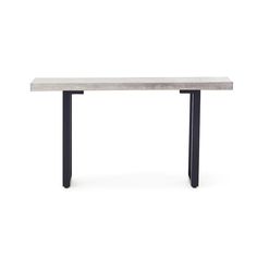 a white table with black metal legs and a long rectangular marble slab on the top