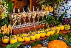 an assortment of food and drinks on display at a wedding or brunch party