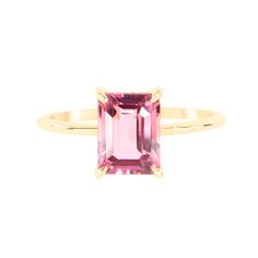 an emerald cut pink tourmaline ring in yellow gold