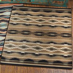 two rugs sitting on top of a wooden floor