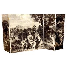 four panel screen with an image of people and animals in the woods on it,