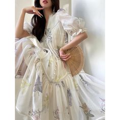 A delicate and lyrical story of flowers that captures the beauty of a moment. A long dress with transparent colors that visualize the nostalgic scent of flowers. It is made with a generous amount of fabric and is decorated with lace embroidery on the cuffs and chest. You will be captivated by the elegant drape. 
 
 
 Size 
 
 S size
 
 Length: 94cm 
 Shoulder width: 32cm 
 Bust: 94cm 
 Sleeve length: 32cm 
 
 
 L size
 
 Length: 96cm 
 Shoulder width: 34cm 
 Bust: 102cm 
 Sleeve length: 33cm Spring Organza Dress With Lace Trim, Spring Wedding Maxi Dress With Sheer Sleeves, Dreamy Summer Dress For Garden Party, Dreamy Dresses For Summer Garden Party, Dreamy Dress For Summer Garden Party, Summer Vintage Floral Print Wedding Dress, Summer Wedding Vintage Dress With Floral Print, Summer Wedding Floral Print Vintage Dress, Spring Cream Organza Dresses