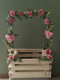 a wooden crate with pink flowers on it