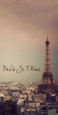 the eiffel tower in paris is lit up at night with words that read paris je t'aime