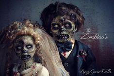 two people dressed up as zombies in wedding attire with veils and hair combs