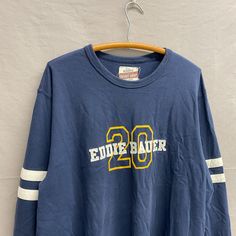 X-Large / Y2K Vintage Eddie Bauer Navy Blue Heavyweight Long Sleeved Shirt Pit to Pit: 25in // Top Collar to Bottom: 29in // Sleeve Length: 35in Blue Long Sleeve Shirt For College, Long Sleeve Blue Shirt For College, 90s Blue Sports Top, 90s Style Blue Shirt For Streetwear, 90s Style Blue Streetwear Shirt, 90s Style Long Sleeve Blue T-shirt, 90s Style Blue Long Sleeve T-shirt, 90s Blue Long Sleeve T-shirt, 90s Blue Crew Neck Top