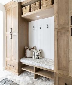 a wooden bench sitting in the middle of a room