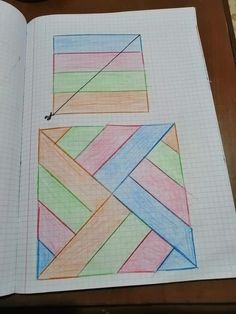 an open book with colored pencils on top of it