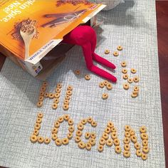 an image of the word laugh spelled out with cereal in front of a bag and book