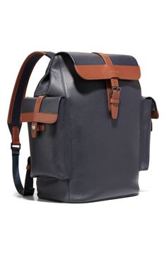 Perfectly equipped for travel, this sturdy leather backpack is furnished with exterior snap-flap pockets and a padded laptop compartment. Flap top with buckle-strap closure Adjustable backpack straps Two exterior snap-flap pockets Interior wall pockets; laptop pocket Laptop pocket fits most 16" laptops Trolley sleeve Lined Leather Imported Leather Flap Bag With Buckle Closure, Leather Bag With Buckle Closure And Flap, Classic Travel Backpack With Detachable Strap, Classic Leather Backpack With Adjustable Strap And Flap, Leather Backpack With Detachable Strap For Business, Classic Leather Flap Backpack, Classic Coated Canvas Backpack With Leather Trim, Classic Backpack For Trips, Luxury Leather Coated Canvas Backpack For Travel