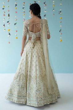 Ivory lehenga with attached cancan, embroidered with mirror, tonal silken thread motifs and gotta patti work. Comes with padded blouse and scallop border dupatta.
Component: 3
Embroidered
Neckline: Sweetheart
Sleeve Length: Half
Fabric: Raw Silk; Dupatta: Net; Lining: Cotton Crepe
Color: White
Tassel tie-up back
Scallop dupatta
Kamar latkans - Aza Fashions Gotta Patti Work Embroidery, Scallop Dupatta, Ivory Lehenga, Gotta Patti Work, Raw Silk Lehenga, Scallop Border, Gotta Patti, Padded Blouse, White Tassel