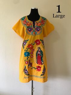 Beautiful Virgin Mary embroidered dress. This dress is 100% cotton and is made in Chiapas, Mexico! LARGE: Shoulder to Shoulder: 26in wide Chest& Waist: 48in around Hip: 50in around MEDIUM: Shoulder to Shoulder: 23.5in wide Chest& Waist: 44in around Hips: 47in around SMALL: Shoulder to Shoulder: 23in wide Chest& Wide: 38in around Hips: 46in around Cotton Dresses With Tonal Embroidery For Summer, Cotton Dresses With Machine Embroidery And Short Sleeves, Cotton Dress With Tonal Embroidery For Summer, Traditional Cotton Dresses With Tonal Embroidery, Short Sleeve Cotton Dress With Intricate Embroidery, Short Sleeve Cotton Embroidered Dress With Floral Embroidery, Traditional Cotton Dress With Machine Embroidery, Summer Cotton Dress With Tonal Embroidery, Short Sleeve Cotton Dress With Multicolor Embroidery