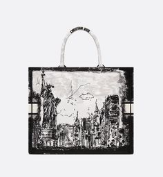 Introduced by Maria Grazia Chiuri, Creative Director of Christian Dior, the Dior Book Tote has become a staple of the Dior aesthetic. Designed to hold all the daily essentials, it is fully embroidered with the white and black New York motif, a pillar of the collection that celebrates the city's skyline and the Statue of Liberty in a graphic spirit. Adorned with a contrasting Christian Dior Paris signature on the front, the large tote exemplifies the House's savoir-faire and may be carried by han Christian Dior Handbags, Dior Aesthetic, Black New York, Dior Book, Christian Dior Paris, Dior Paris, The Statue Of Liberty, Dior Book Tote, Maria Grazia Chiuri